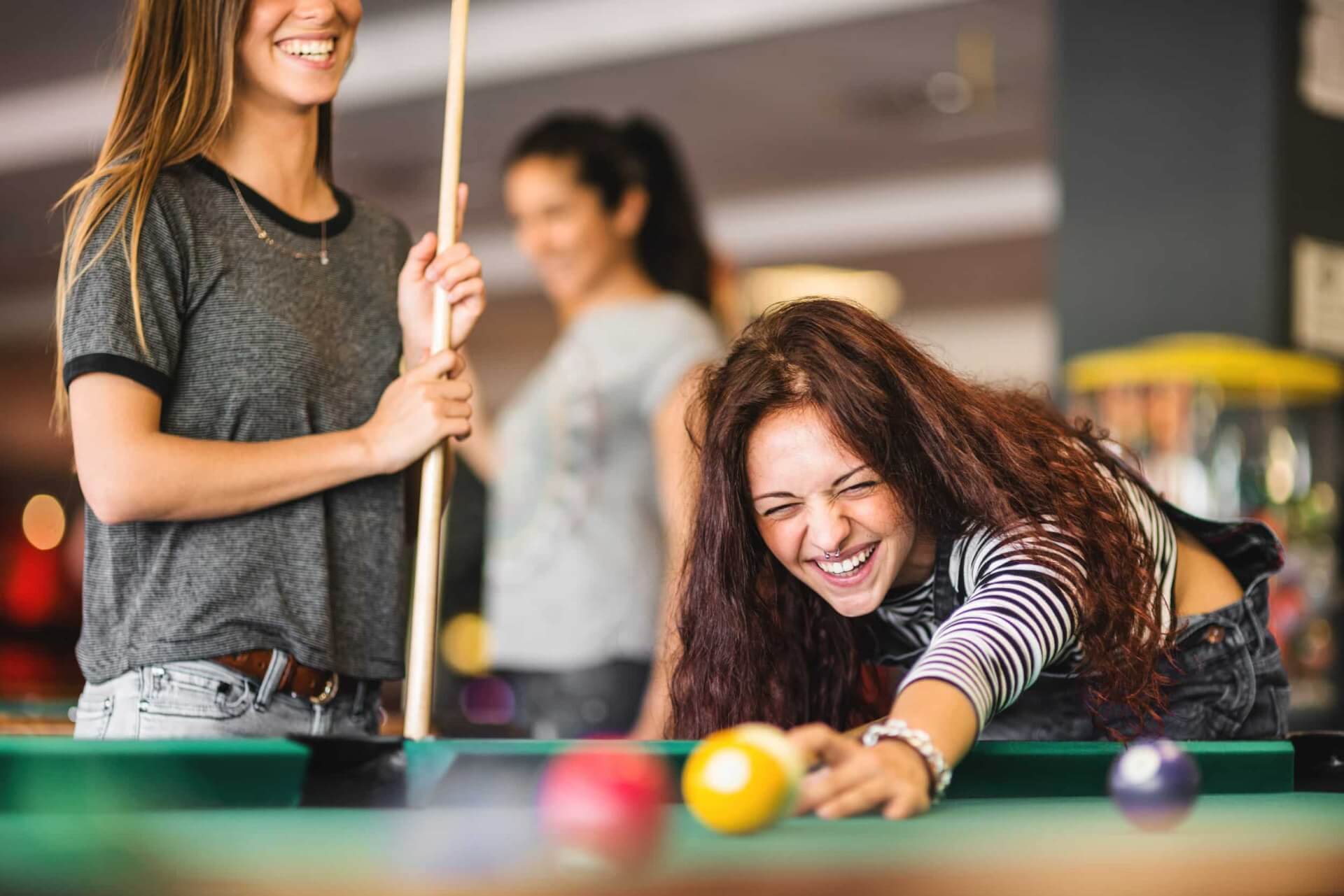 two people playing pool istock 474403912